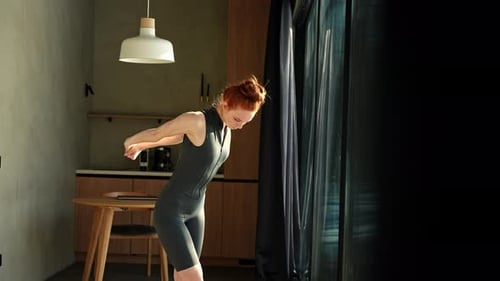 Woman Stretching Arms and Back Indoors