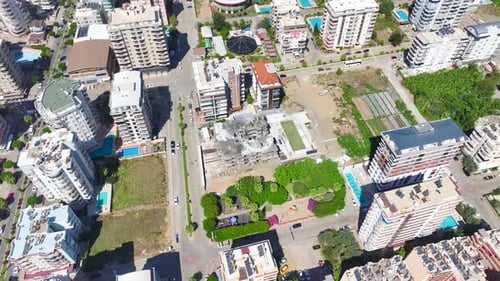 Aerial View Workers on a Construction Site Demonstrating Progress With Skill and Experience
