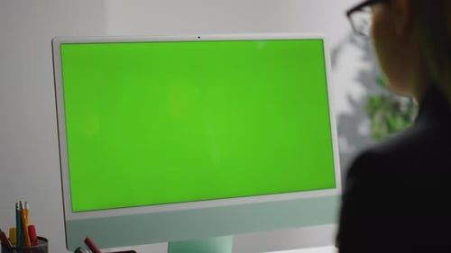 Closeup Office Green Desktop Computer. Freelancer Surfing Web Checking Report in Mockup