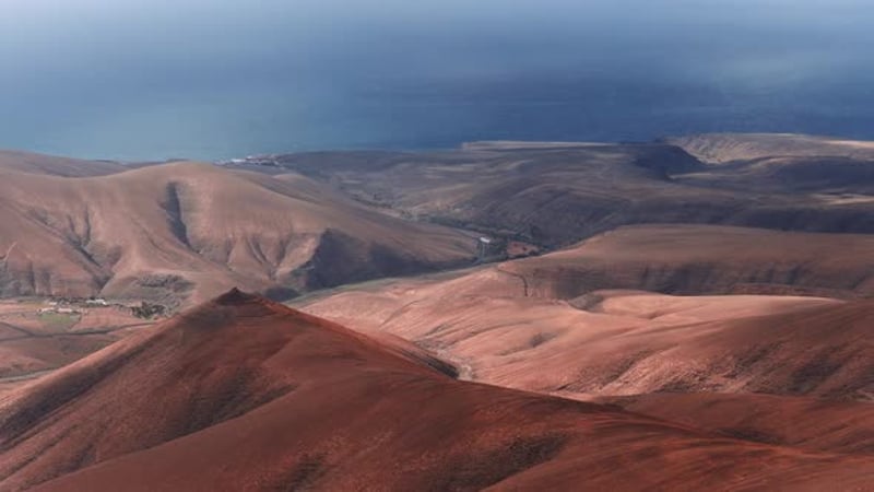 Scenic View of Red Mountains and Small Village, Buildings Stock Footage ...