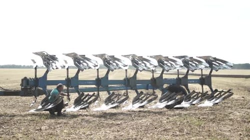 Tractors plowing the field in Ukraine