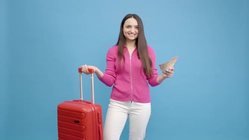 Happy Woman With Euros and Red Suitcase