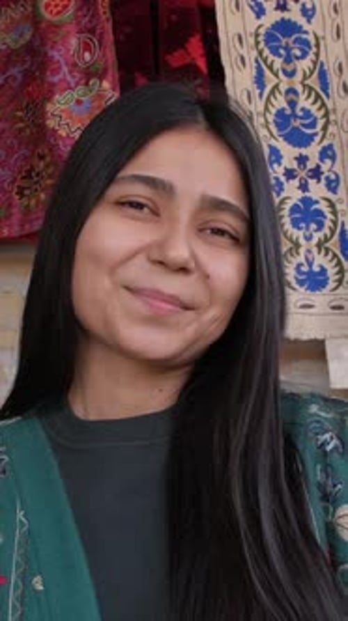 Portrait of Smiling Young Woman with Black Hair