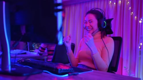 Woman Playing Video Games in Colorful Room