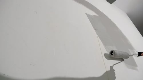 Wall Being Painted with a Paint Roller