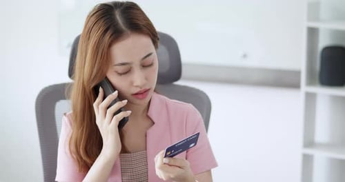 Woman Calling Bank to Resolve Credit Card Issue and Prevent Online Fraud