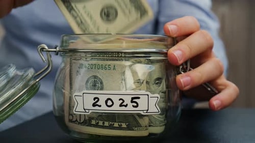 Saving Money in Jar Labeled 2025