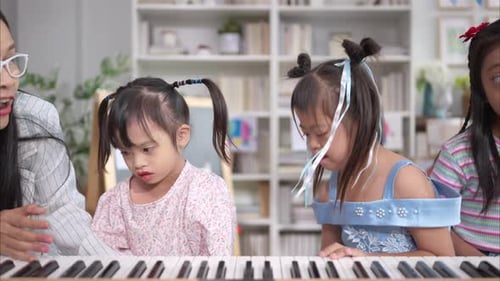 Piano Class with Teacher and Attentive Young Students