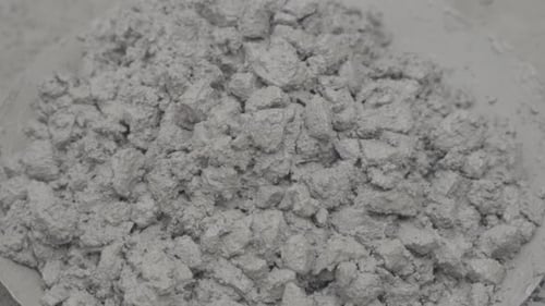 Mixing Gray Cement or Concrete for Construction Project