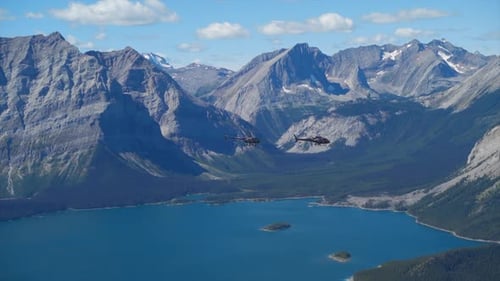 A thrilling helicopter tour of the Canadian Rocky Mountains, breathtaking aerial views of snow-cappe