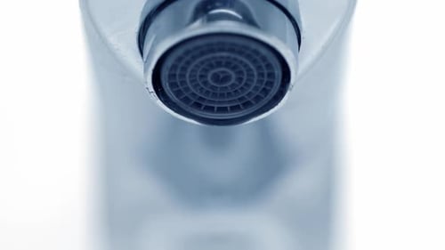 Water Drops from a Shiny Chrome Faucet