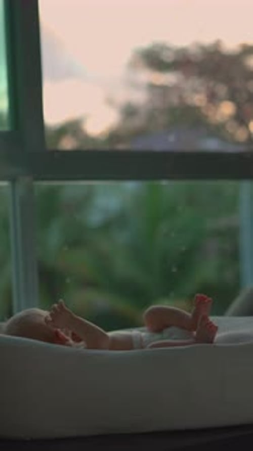 Cute Baby Lying Down at Sunset