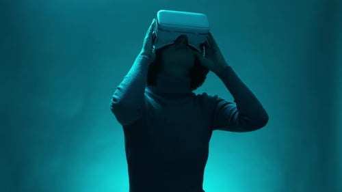 Woman Removing VR Headset in a Studio