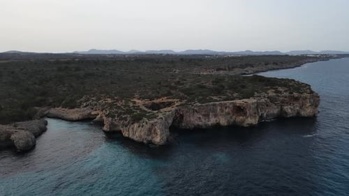 Aerial drone view of Cala Varques beach in Mallorca, Spain. orbit shot.