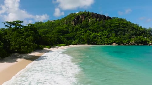 Turquoise Waves Rolling on a Tranquil Sandy Beach Seychelles Mahe