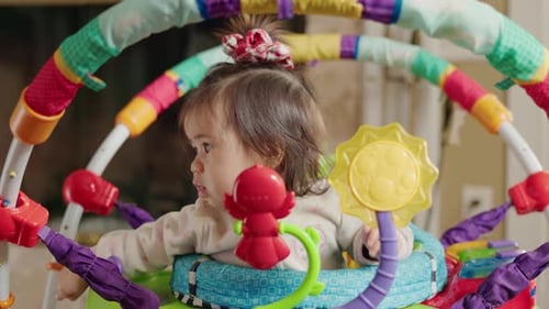 Baby Playing with Toys in Activity Center