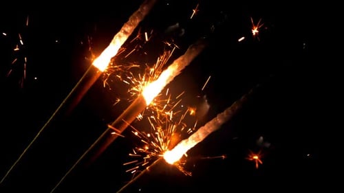 Festive Sparklers Lighting Up The Dark Night