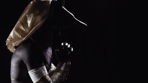 Performer in Anubis Costume in the Dark