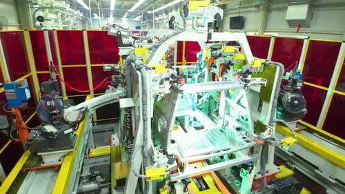 Factory technology robot arm works that assembles lithium or sodium batteries used in electric cars.
