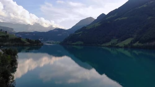 Scenic aerial panorama of Lungernersee lake in Switzerland on summer evening