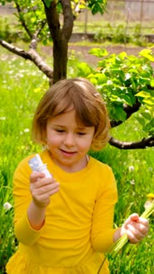 Girl with Dandelions and Bottle in a Grassy Field