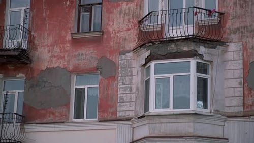 Weathered Building Exterior with Aged Facade