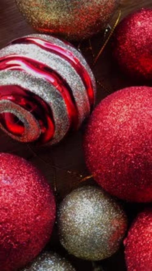 Sparkling Red and Gold Christmas Ornaments Close Up