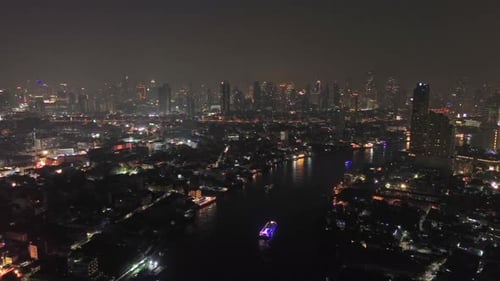 Skyscrapers in Bangkok City and River at Night