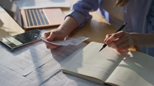 Financial Management at Desk with Laptop and Calculator