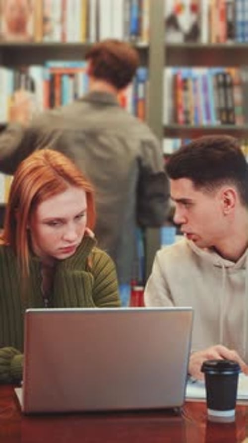 Vertical Screen Group of Students Studying in Library