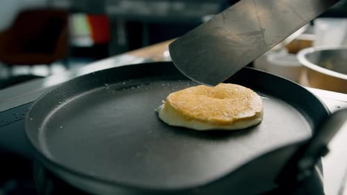 Pancake Cooking in Frying Pan with Spatula
