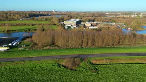 Aerial view of green fields near river, United Kingdom.