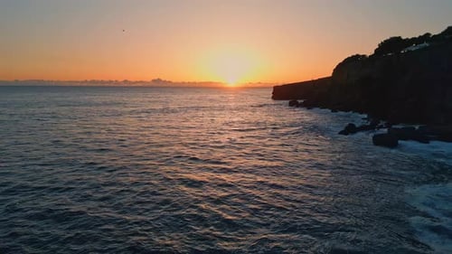 Serene Coast Rippling Ocean Shaking at Sunset Drone View. Picturesque Sea Waves