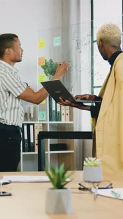 Close Up of Men Office Workers Which Working Together in Modern Workroomthey Discussing Datas on
