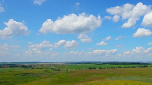 Rolling Green Fields Under a Blue Sky