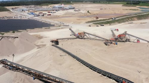 Sand Processing Plant With Conveyor Belts, And Solar Panels. Quarry Industry. aerial shot