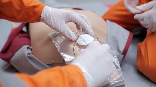 Placing Breathing Barrier Mask on CPR Mannequin