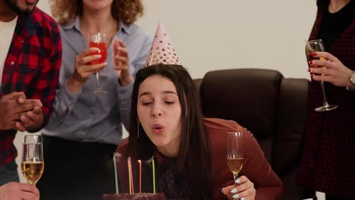 A Longhaired Brunette is Celebrating Her Birthday in the Office with Colleagues A Woman in a Festive