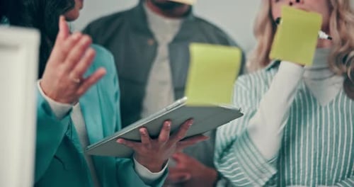 Business, tablet and people with sticky note in meeting for problem solving