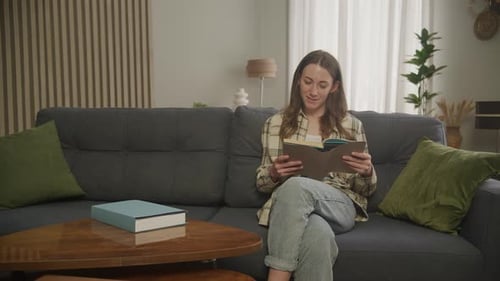 Woman Reading a Book in Flat