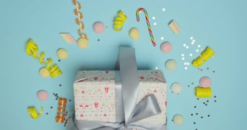 Hands Present Gift with Birthday Decorations