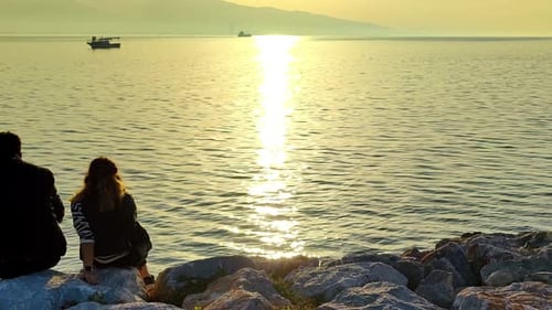 Loving Couple Looking At The Sun