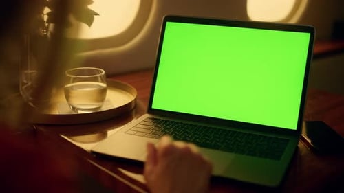 Woman Watching Green Screen Laptop on Flight
