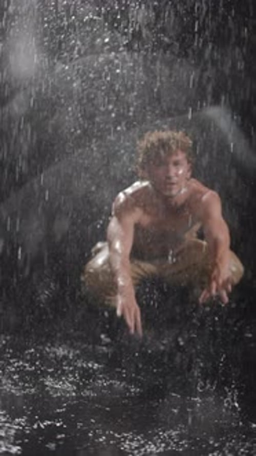 Male Model Dancing and Posing in the Rain