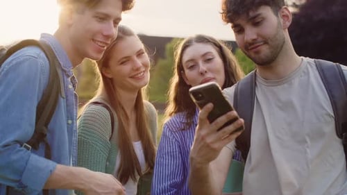 Group of caucasian students taking selfie outside the university campus. Shot with RED helium camera