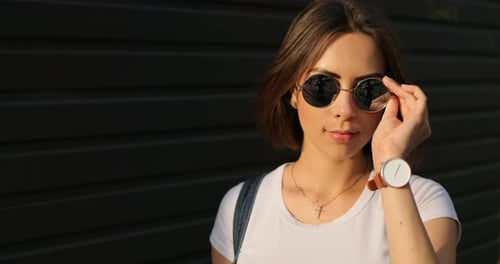 Attractive Woman Wearing Sunglasses Posing Outdoors