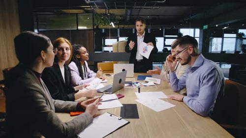 Business Team Meeting Presentation in Modern Office