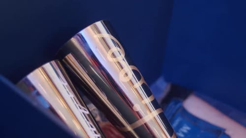 Shiny Silver Tumblers with Writing in Blue Box