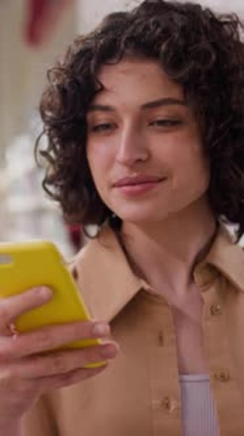 Woman Looking At Her Cellphone
