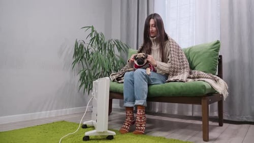 Woman with Pet Pug Dog Indoors